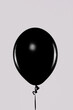 Minimalist Black Balloon on Light Grey Background