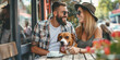 Beautiful young couple sitting in outdoor cafe with their dog on sunny summer day. Pet-friendly restaurants and cafes.