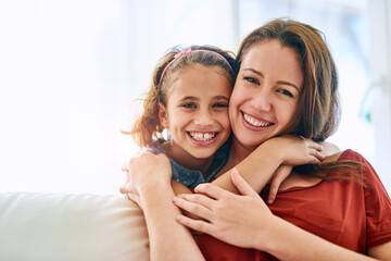 Wall Mural - Mom, girl and hug in portrait with smile for support, care and appreciation at family home. Kid, woman and affection in living room with love on sofa for trust, gratitude and bonding on mothers day