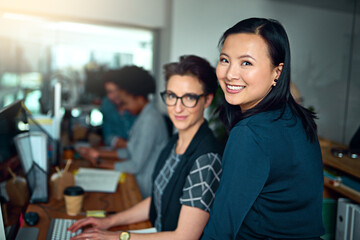 Poster - Women, web designer and smile in portrait as employees in workplace for development, collaboration and teamwork. Female people, workers and creative for design, company or startup in office for job