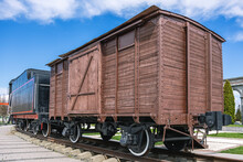 An Old Wooden Two-axle Boxcar. A Type Of Railway Two-axle Covered Freight Car. The Design Of The Wagon Provides For The Possibility Of Rapid Conversion For The Transportation Of People And Animals.