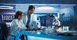 © Gorodenkoff - Asian And Caucasian Female Doctors Talking In Medical Research Center And Using Desktop Computer To Analyze MRI Scans Of Brain. Surgeon And Neuroscientist Discussing Solutions For Treating Alzheimer's