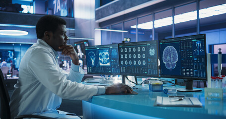 Aufkleber - Cancer Research Center Medical Laboratory: Black Male Neuroscientist Using Desktop Computer To Analyze CT Scans Of Human Brain. African Specialist Studying Brain Tumor, Finding Solutions, Treatment.