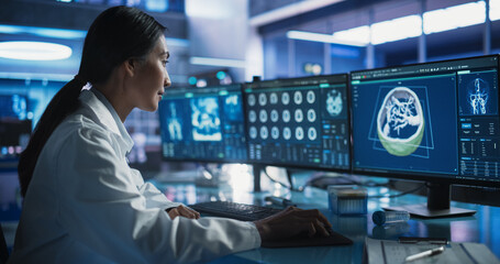 Aufkleber - Female Asian Neurologist Using Desktop Computer With Human Brain MRI Scans In Modern Medical Research Center Laboratory. Professional Doctor Looking At Patient's Brain In 3D Software, Finding Tumors.