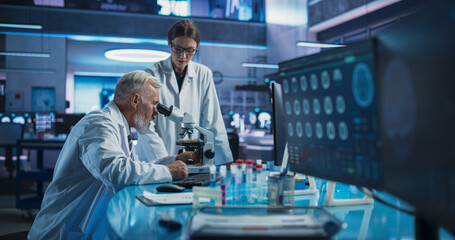 Poster - Caucasian Male Neuroscientist Using Microscope to Analyze Petri Dish Sample And Talking To Female Docor In Medical Research Center. Colleagues Discussing Development Of Innovative Mental Disorder Drug