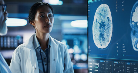 Poster - Neuroscience Laboratory Meeting: Close-Up Female Asian Scientist And Male Surgeon Discussing MRI Brain Scan On TV Display. Specialists Working On Medicine For Rehabilitation After Stroke