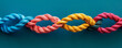 Colorful intertwined ropes on a blue background.