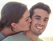 Man, woman and couple kiss with smile for outdoor date with connection, anniversary or romance. Happiness, bonding and travel holiday in Australia for relationship love or weekend, vacation or relax