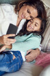 Happy, mother and girl with smartphone selfie for social media, family picture or bonging together. Smile, parent and daughter with mobile for fun on vacation, school holiday and memories with love