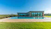 Texas Tranquility: A Contemporary Retreat With A Sprawling Pool And Panoramic Views"
"Luxe Living In The Lone Star State: Modern Oasis With Cascading Windows And Lush Surroundings"