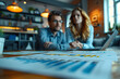© Nansan - Financial Advisor and Client Discussing Goals in Corporate Office