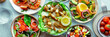 Fresh salads panorama, overhead flat lay shot of an assortment. Variety of plates and bowls with green vegetables. Healthy food, top shot