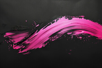 Pink ink brush stroke on black background. Japanese style.