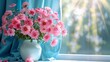   A white vase, brimming with pink blooms, sits before bright blue drapes on a windowsill