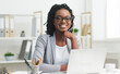 © Prostock-studio - Afro Business Lady Smiling At Camera Sitting At Laptop