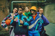 Youthful spirit of street fashion. Stylish young people, boys and girls wearing vintage inspired street clothes, tracksuits, posing outdoors. Concept of 90s, fashion, youth culture, old-style trends