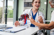 © NanSan - Caucasian woman accompanies an elderly Asian woman dealing with Hepatitis B, cirrhosis, and liver cancer. They seek medical advice and support together. Liver model learning