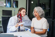 Caucasian woman accompanies an elderly Asian woman dealing with Hepatitis B, cirrhosis, and liver cancer. They seek medical advice and support together. Liver model learning