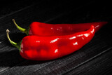 Fototapeta Mapy - sweet pepper on black wood background