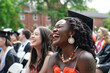 Candid moment of multi-ethnic graduates sharing laughter and joy, capturing the essence of friendship and achievement.