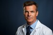 © duyina1990 - Portrait of a male doctor in a white coat and blue tie