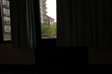 Poster - Interior of a house with a window with curtains