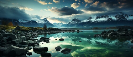 Wall Mural - Mountains and lake landscape with rocks in the foreground