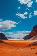 Desert landscape with blue sky and white clouds