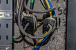 Electricity meters. Electrical panel. Electrical wires. Readings from electrical metering devices.	