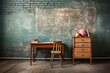 Vintage schoolroom interior with blackboard, wooden table and chair