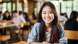 © duyina1990 - Portrait of a smiling young Asian woman sitting in a cafe