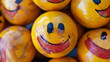 Yellow, worn and dirty smiling balls
