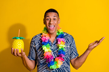 Wall Mural - Photo of handsome impressed guy wear print shirt hawaii necklace enjoy fruit juice isolated yellow color background