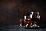 Fototapeta  - Strong alcohol drink. Whisky, rum, tequila, cognac at dark bar.