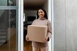 © Rawpixel.com - Woman receiving delivery package to her front door