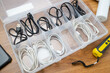 Many USB charging cables of phone and electrical appliances are neatly stored in the plastic storage box
