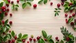Beautiful top view of red cherries and green leaves arranged on a wooden background with ample copy space.