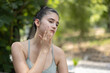 Woman apply sunscreen lotion before outdoor workout