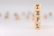 © PHalexaviles - Acronym TEFL. Concept of Teaching English as a foreign language written on wooden cubes isolated on white background