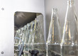 Prior to being filled, glass beverage bottles undergo a thorough cleaning process in a dedicated industrial dishwasher