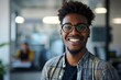 © Radiant Reflections - Close-up portrait of a young male designer, programmer, developer standing inside an office environment, smiling and confidently looking at the, Generative AI