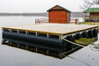 Large floating wooden platforms on pontoons with holiday houses in the lake for leisure and fishing