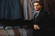 Businessman in classic vest against suit jackets, shop store clothes for men