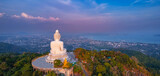 Fototapeta  - Panoramic photo of statue big Buddha in Phuket on sunset sky, aerial top view. Concept travel Thailand landmark