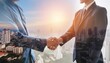 © Marko - double exposure shot of silhouettes of business team people and handshake on city background