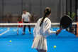  Young Girls Is Playing Padel on an Court.