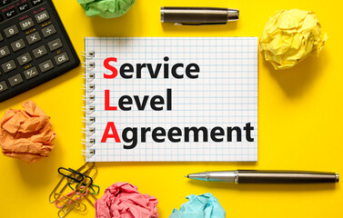 Wall Mural - SLA service level agreement symbol. Concept words SLA service level agreement on beautiful white note. Beautiful yellow background. Business SLA service level agreement concept. Copy space.