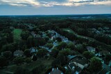 Fototapeta Miasto - Aerial panoramic view of an upscale suburb and lush green landscape in USA shot during early spring of 2024