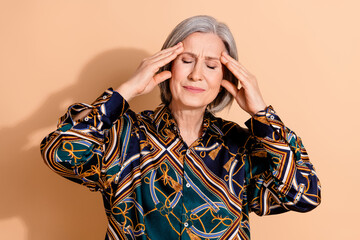 Sticker - Photo of suffering senior person with gray hairdo wear print blouse hands touching head eyes closed isolated on beige color background