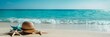 © inspiretta - hat and starfish on a beach with the wave coming in from the ocean